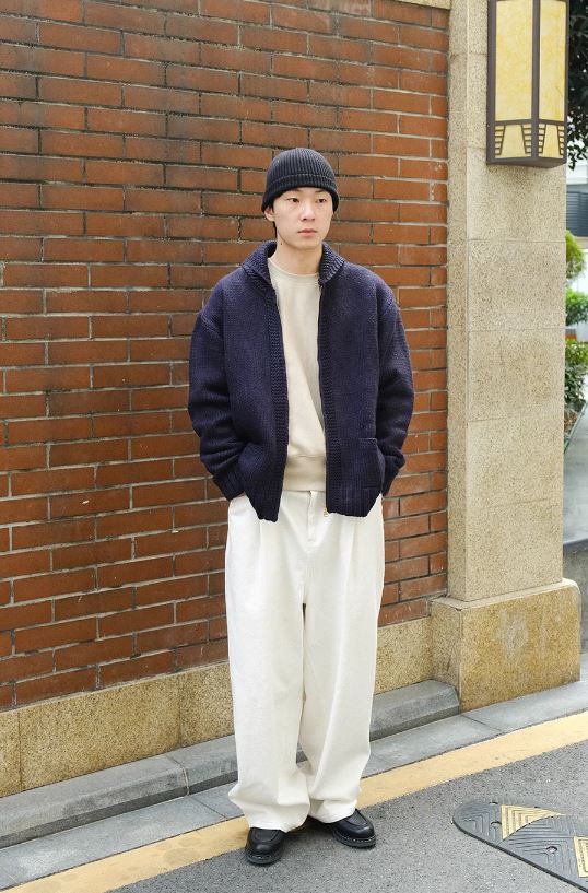 A Eckhaus Latta Shirt pictured on a model in front of a white background. The title of the product is Eckhaus Latta Eclipse Turtleneck - Stone and the image was taken by 199A®.