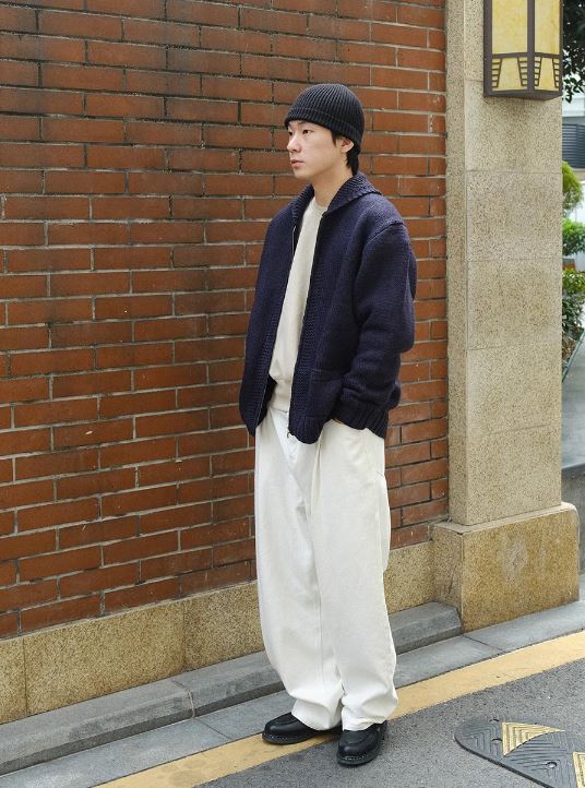 A Eckhaus Latta Shirt pictured on a model in front of a white background. The title of the product is Eckhaus Latta Eclipse Turtleneck - Stone and the image was taken by 199A®.