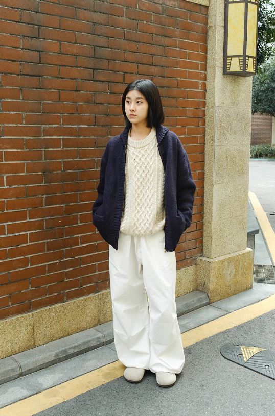 A Eckhaus Latta Shirt pictured on a model in front of a white background. The title of the product is Eckhaus Latta Eclipse Turtleneck - Stone and the image was taken by 199A®.