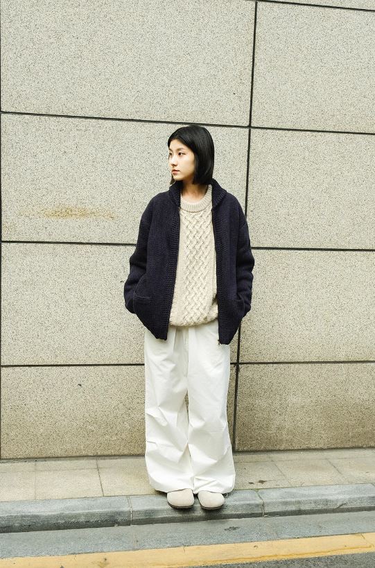 A Eckhaus Latta Shirt pictured on a model in front of a white background. The title of the product is Eckhaus Latta Eclipse Turtleneck - Stone and the image was taken by 199A®.