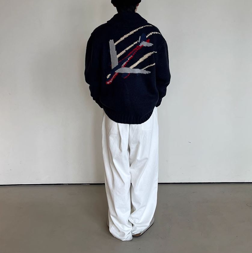 A Eckhaus Latta Shirt pictured on a model in front of a white background. The title of the product is Eckhaus Latta Eclipse Turtleneck - Stone and the image was taken by 199A®.