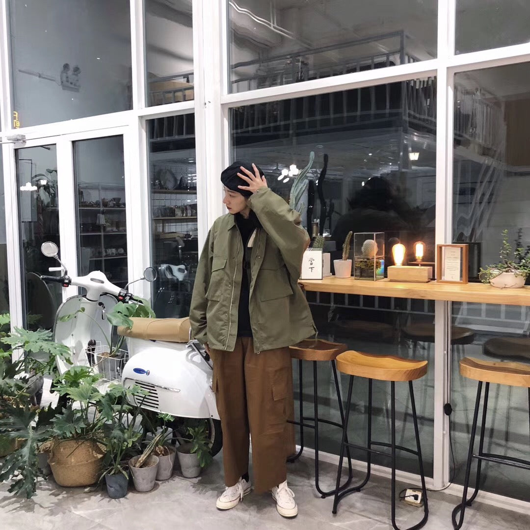 A Eckhaus Latta Shirt pictured on a model in front of a white background. The title of the product is Eckhaus Latta Eclipse Turtleneck - Stone and the image was taken by 199A®.