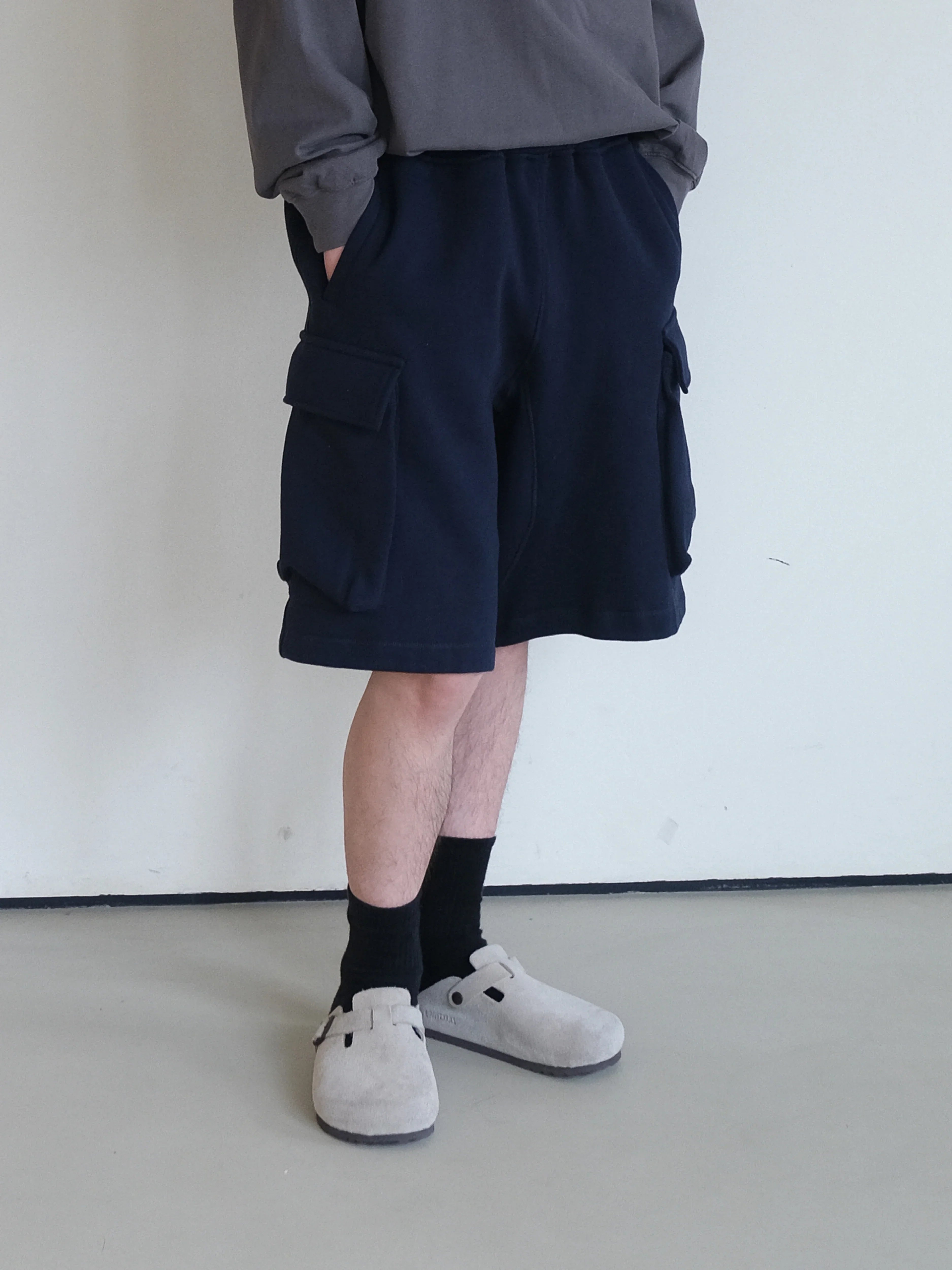 A Eckhaus Latta Shirt pictured on a model in front of a white background. The title of the product is Eckhaus Latta Eclipse Turtleneck - Stone and the image was taken by 199A®.