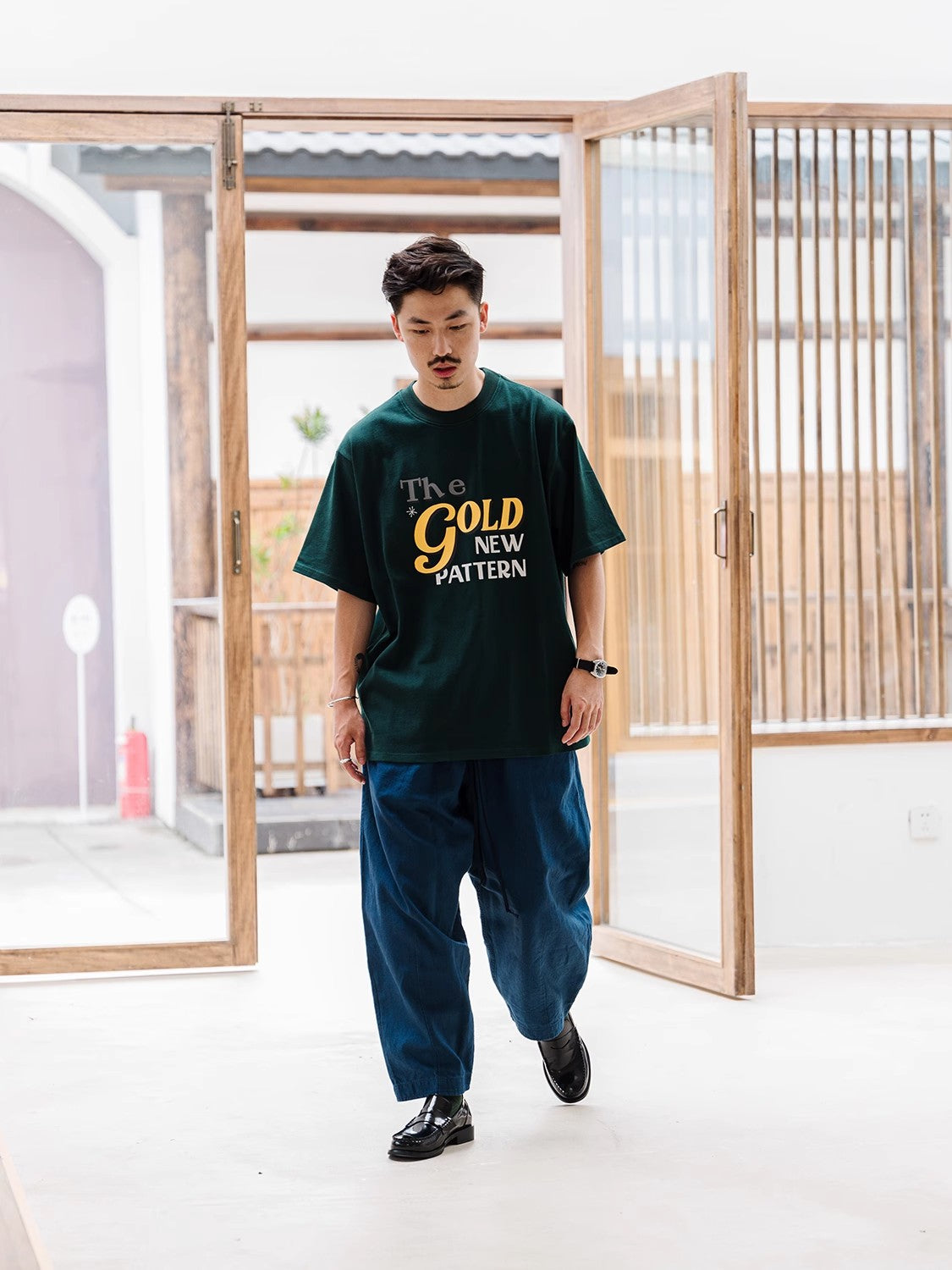 A Eckhaus Latta Shirt pictured on a model in front of a white background. The title of the product is Eckhaus Latta Eclipse Turtleneck - Stone and the image was taken by 199A®.