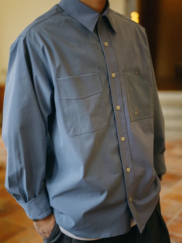 A Eckhaus Latta Shirt pictured on a model in front of a white background. The title of the product is Eckhaus Latta Eclipse Turtleneck - Stone and the image was taken by 199A®.