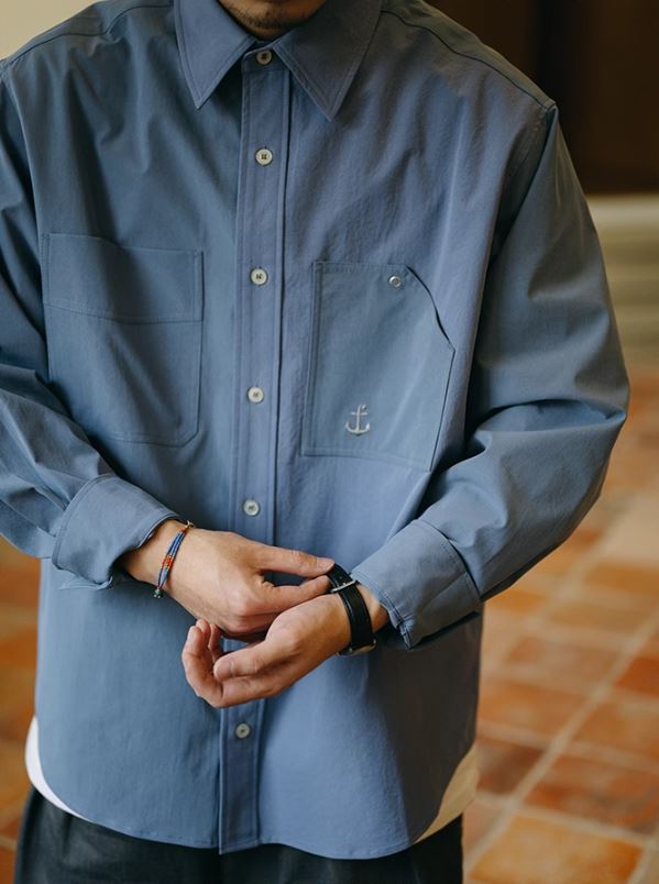 A Eckhaus Latta Shirt pictured on a model in front of a white background. The title of the product is Eckhaus Latta Eclipse Turtleneck - Stone and the image was taken by 199A®.