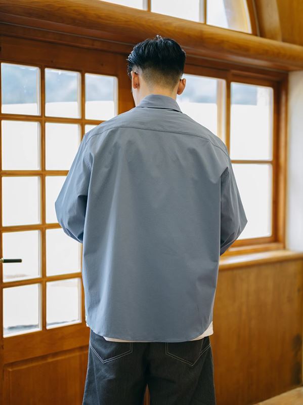 A Eckhaus Latta Shirt pictured on a model in front of a white background. The title of the product is Eckhaus Latta Eclipse Turtleneck - Stone and the image was taken by 199A®.
