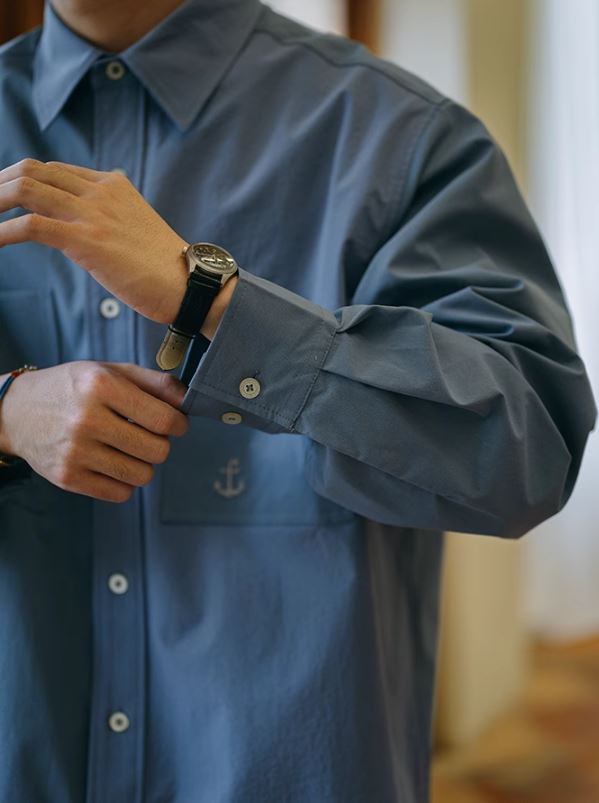 A Eckhaus Latta Shirt pictured on a model in front of a white background. The title of the product is Eckhaus Latta Eclipse Turtleneck - Stone and the image was taken by 199A®.