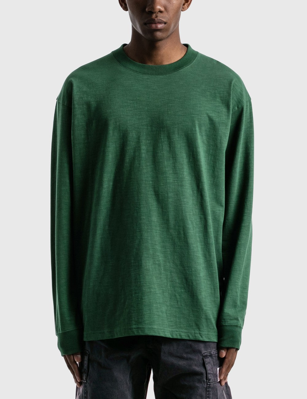 A Eckhaus Latta Shirt pictured on a model in front of a white background. The title of the product is Eckhaus Latta Eclipse Turtleneck - Stone and the image was taken by 199A®.