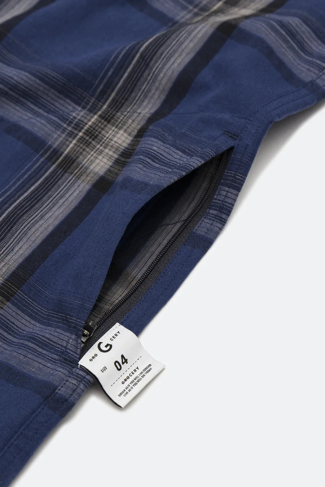 A Eckhaus Latta Shirt pictured on a model in front of a white background. The title of the product is Eckhaus Latta Eclipse Turtleneck - Stone and the image was taken by 199A®.