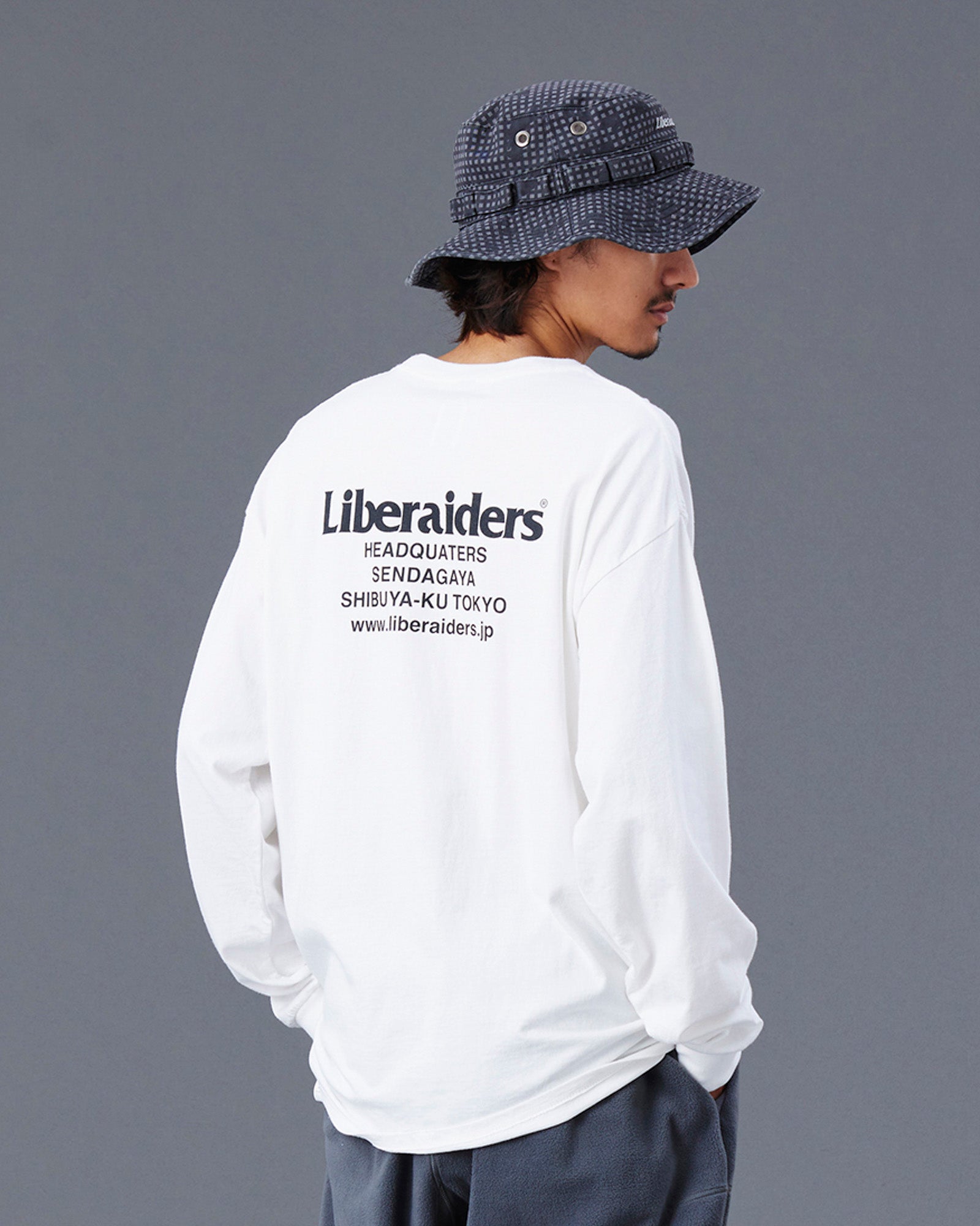 A Eckhaus Latta Shirt pictured on a model in front of a white background. The title of the product is Eckhaus Latta Eclipse Turtleneck - Stone and the image was taken by 199A®.