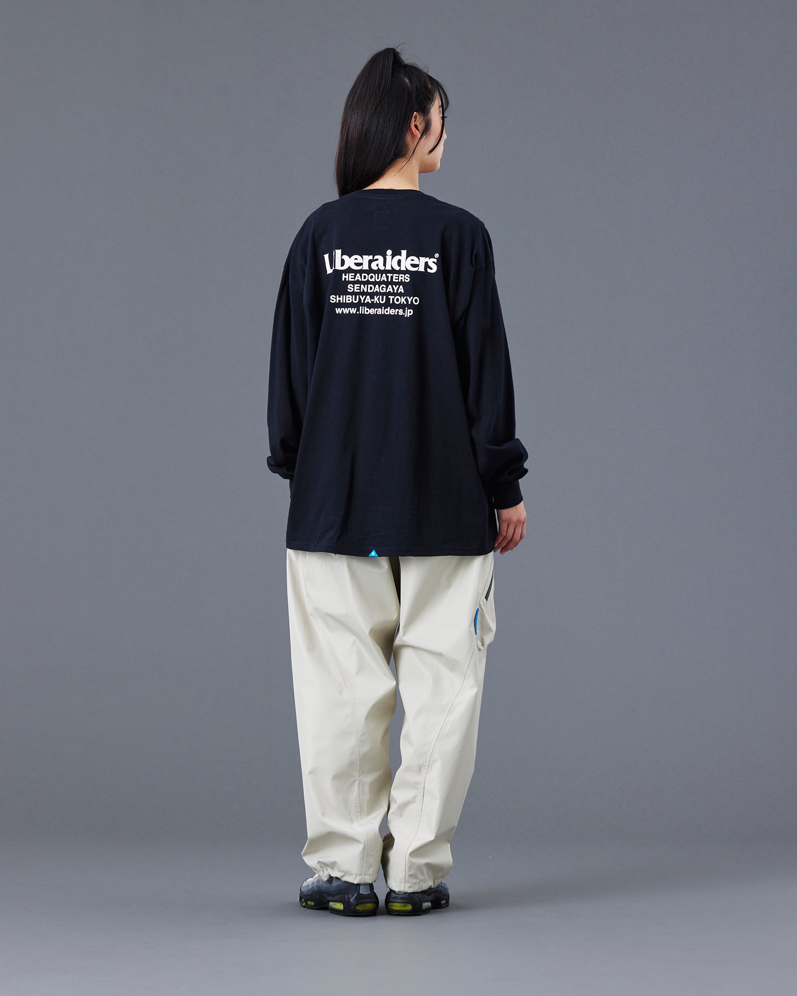 A Eckhaus Latta Shirt pictured on a model in front of a white background. The title of the product is Eckhaus Latta Eclipse Turtleneck - Stone and the image was taken by 199A®.