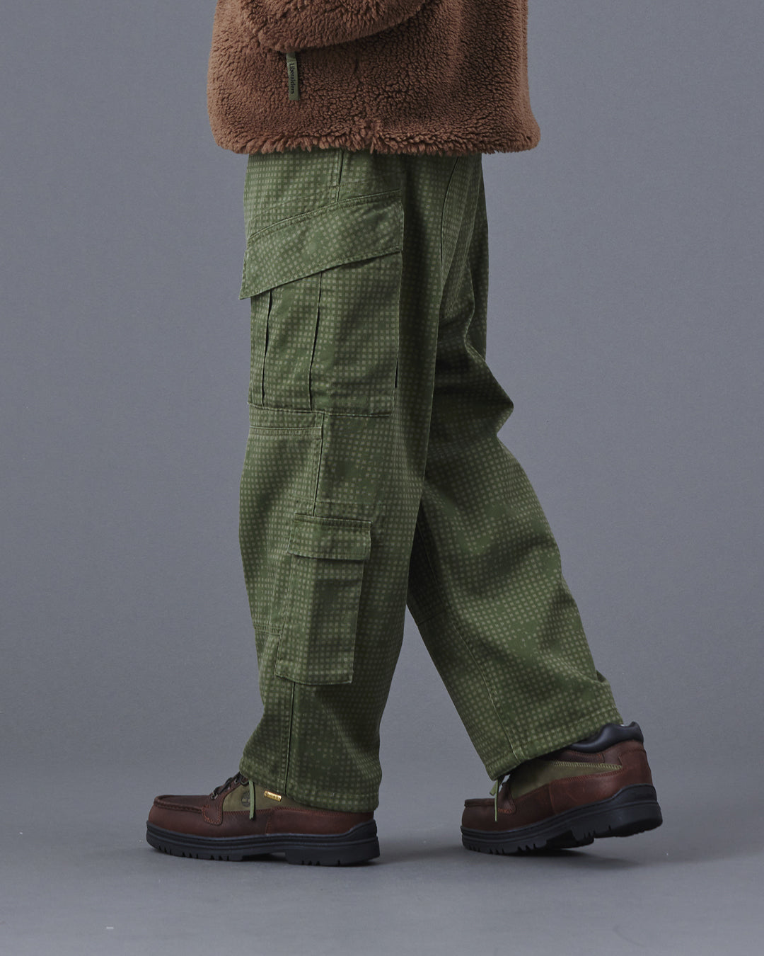 A Eckhaus Latta Shirt pictured on a model in front of a white background. The title of the product is Eckhaus Latta Eclipse Turtleneck - Stone and the image was taken by 199A®.