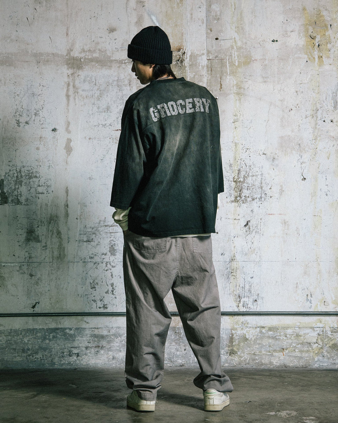 A Eckhaus Latta Shirt pictured on a model in front of a white background. The title of the product is Eckhaus Latta Eclipse Turtleneck - Stone and the image was taken by 199A®.