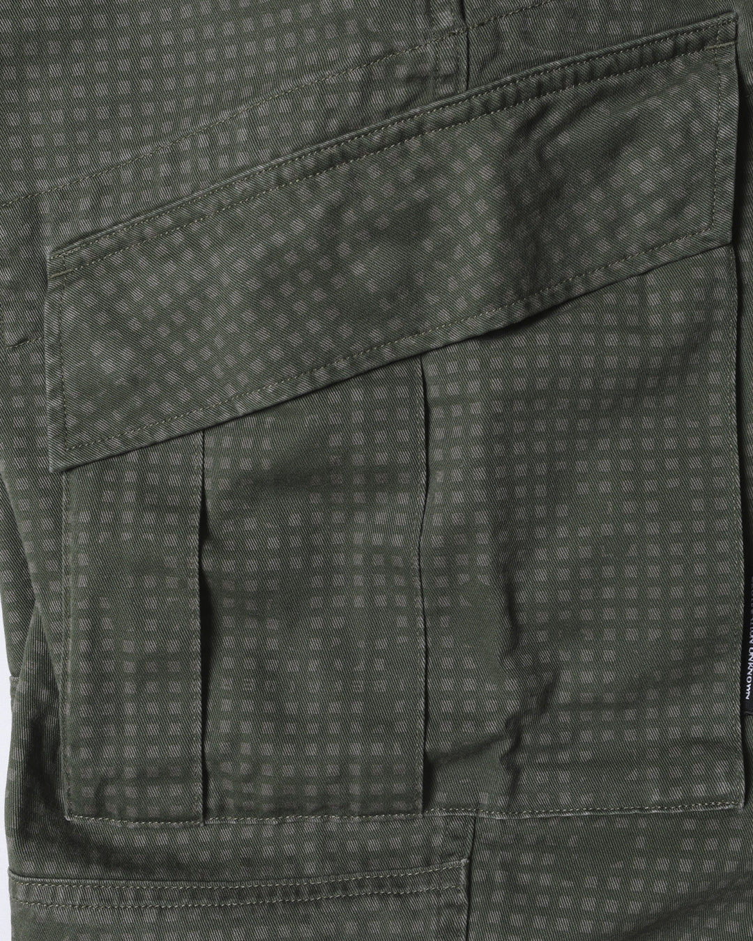 A Eckhaus Latta Shirt pictured on a model in front of a white background. The title of the product is Eckhaus Latta Eclipse Turtleneck - Stone and the image was taken by 199A®.