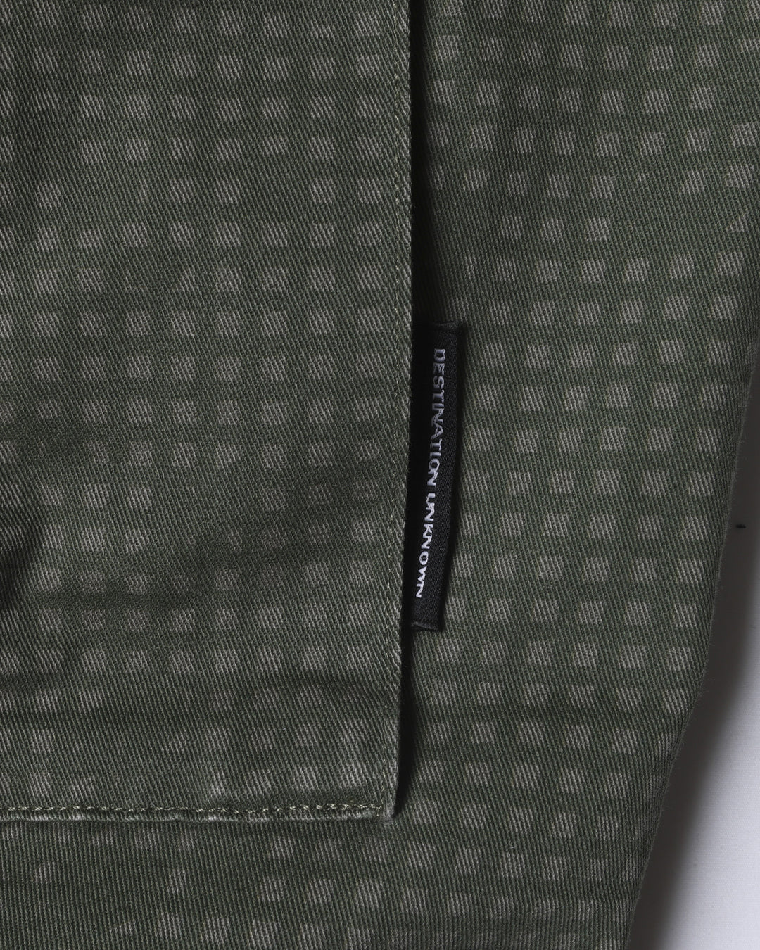 A Eckhaus Latta Shirt pictured on a model in front of a white background. The title of the product is Eckhaus Latta Eclipse Turtleneck - Stone and the image was taken by 199A®.