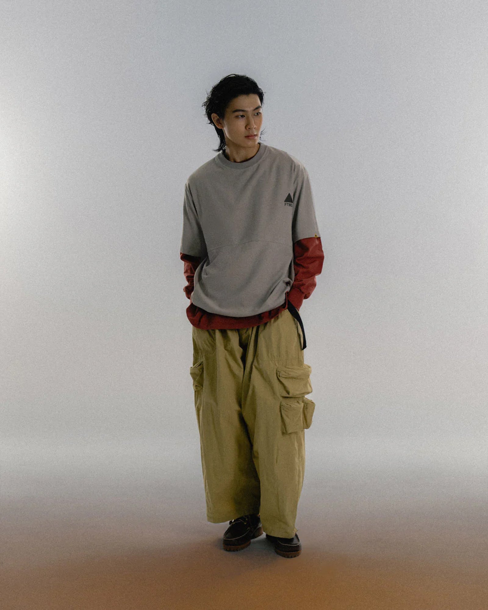 A Eckhaus Latta Shirt pictured on a model in front of a white background. The title of the product is Eckhaus Latta Eclipse Turtleneck - Stone and the image was taken by 199A®.