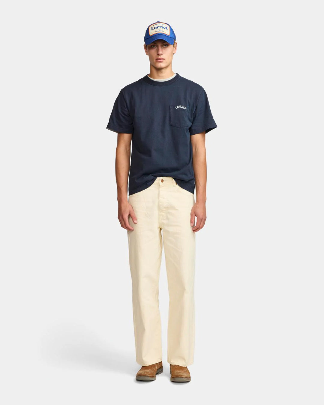 A Eckhaus Latta Shirt pictured on a model in front of a white background. The title of the product is Eckhaus Latta Eclipse Turtleneck - Stone and the image was taken by 199A®.