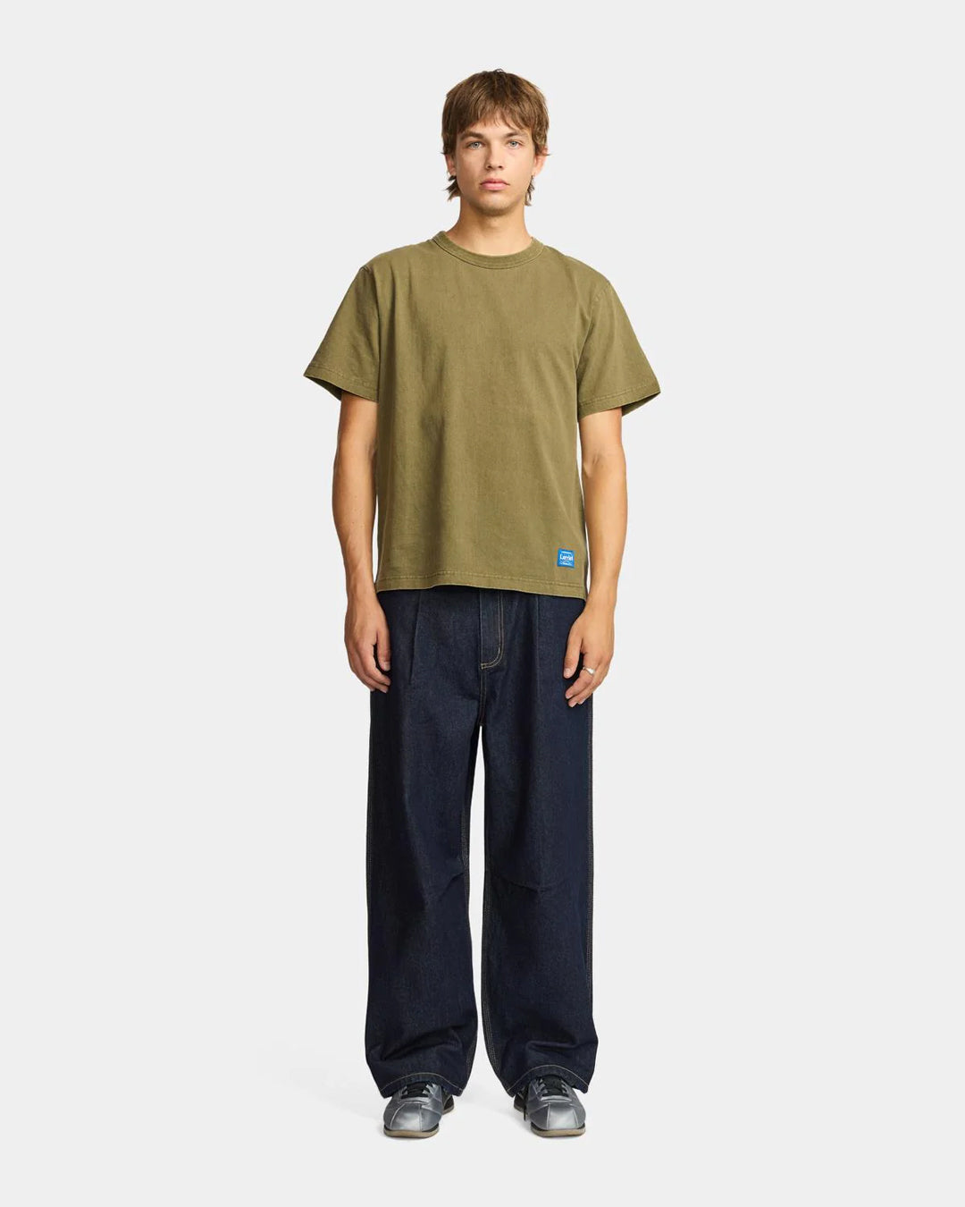 A Eckhaus Latta Shirt pictured on a model in front of a white background. The title of the product is Eckhaus Latta Eclipse Turtleneck - Stone and the image was taken by 199A®.