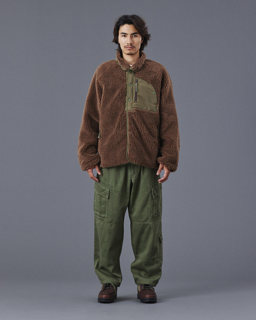 A Eckhaus Latta Shirt pictured on a model in front of a white background. The title of the product is Eckhaus Latta Eclipse Turtleneck - Stone and the image was taken by 199A®.