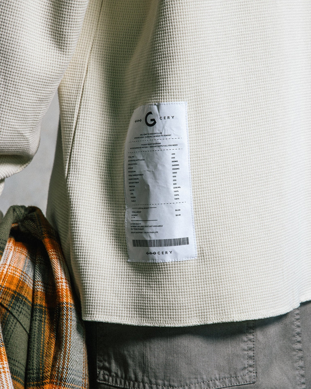 A Eckhaus Latta Shirt pictured on a model in front of a white background. The title of the product is Eckhaus Latta Eclipse Turtleneck - Stone and the image was taken by 199A®.