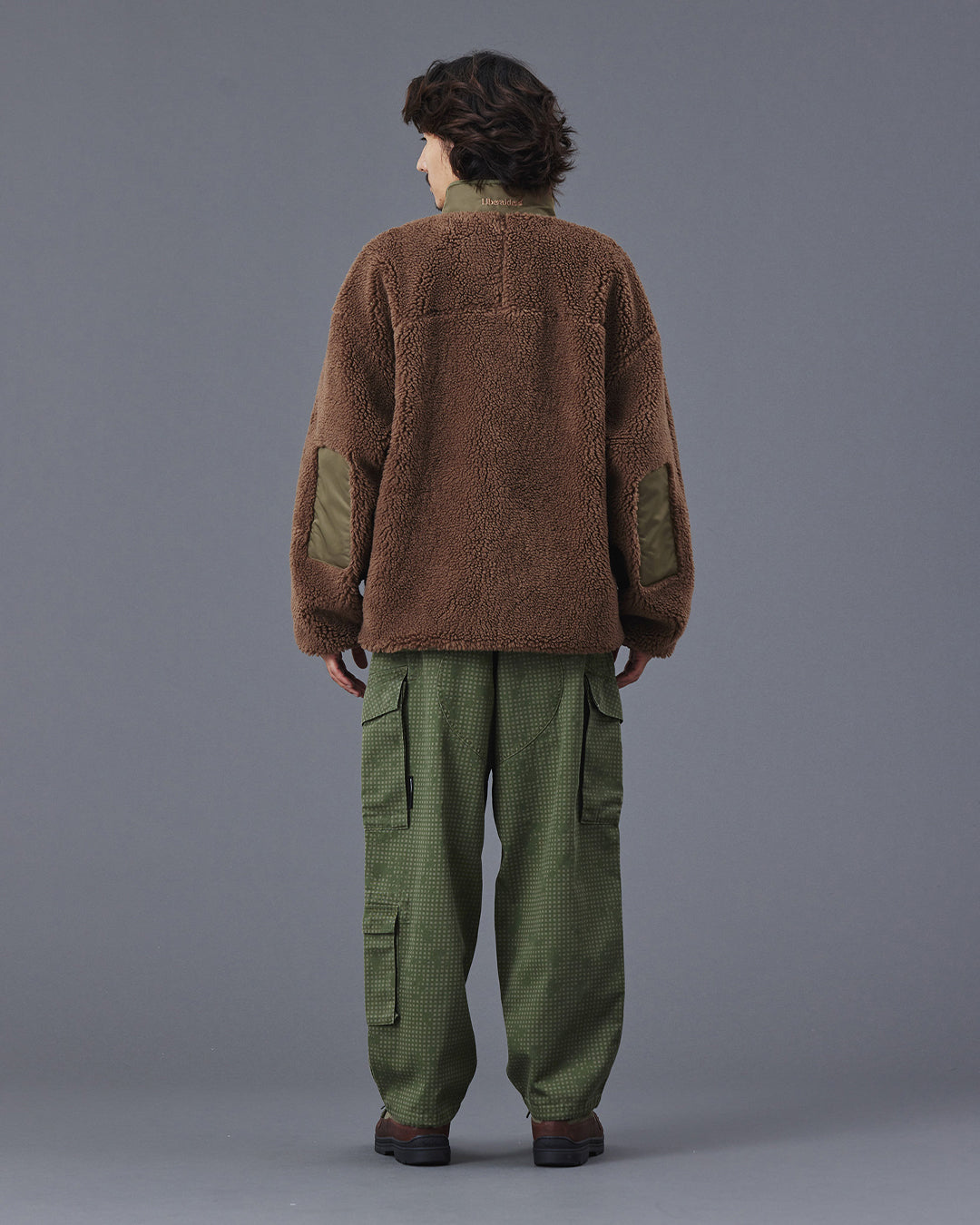 A Eckhaus Latta Shirt pictured on a model in front of a white background. The title of the product is Eckhaus Latta Eclipse Turtleneck - Stone and the image was taken by 199A®.
