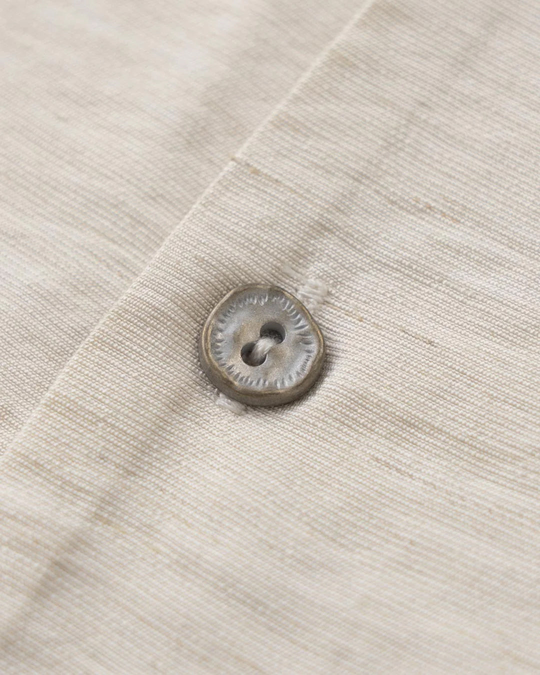 A Eckhaus Latta Shirt pictured on a model in front of a white background. The title of the product is Eckhaus Latta Eclipse Turtleneck - Stone and the image was taken by 199A®.