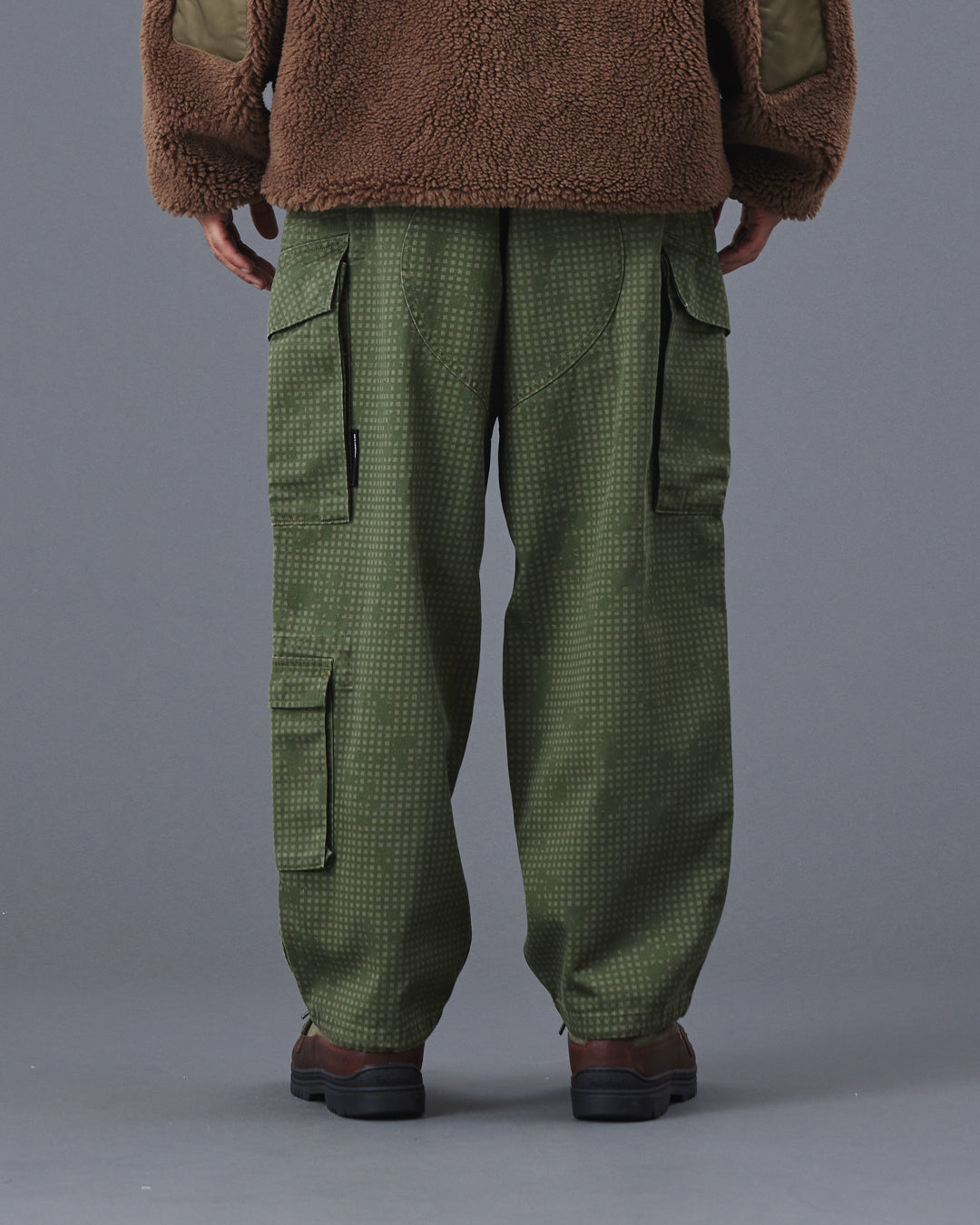 A Eckhaus Latta Shirt pictured on a model in front of a white background. The title of the product is Eckhaus Latta Eclipse Turtleneck - Stone and the image was taken by 199A®.