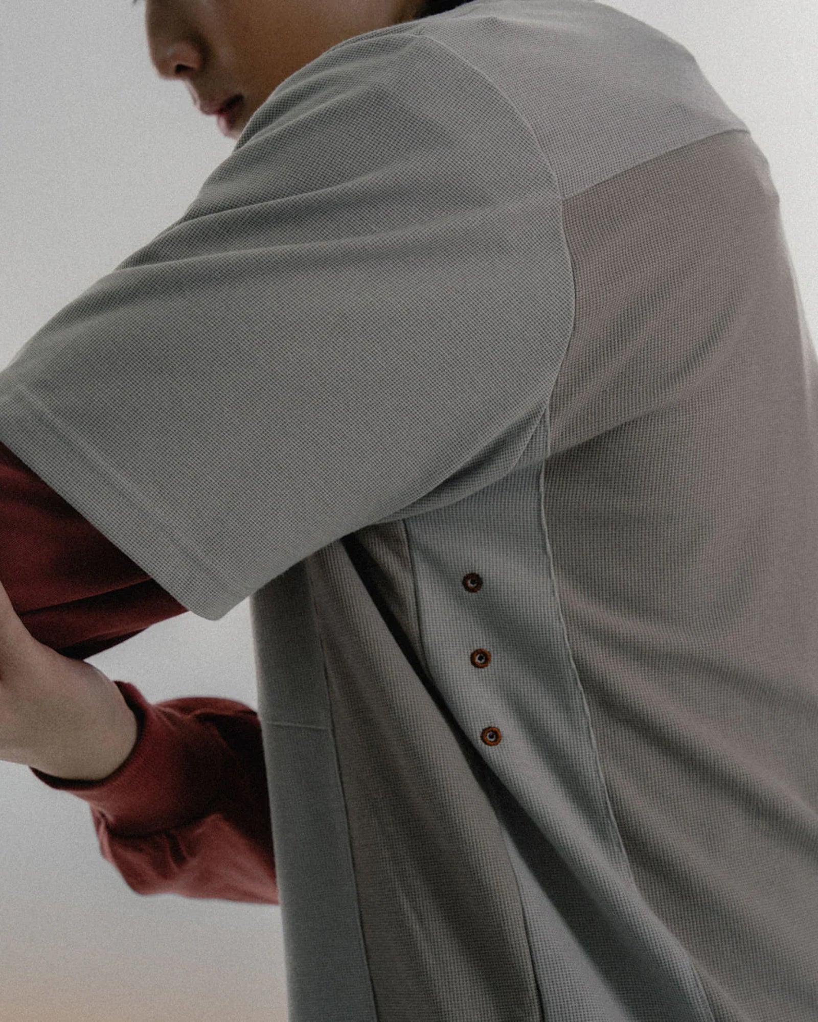 A Eckhaus Latta Shirt pictured on a model in front of a white background. The title of the product is Eckhaus Latta Eclipse Turtleneck - Stone and the image was taken by 199A®.