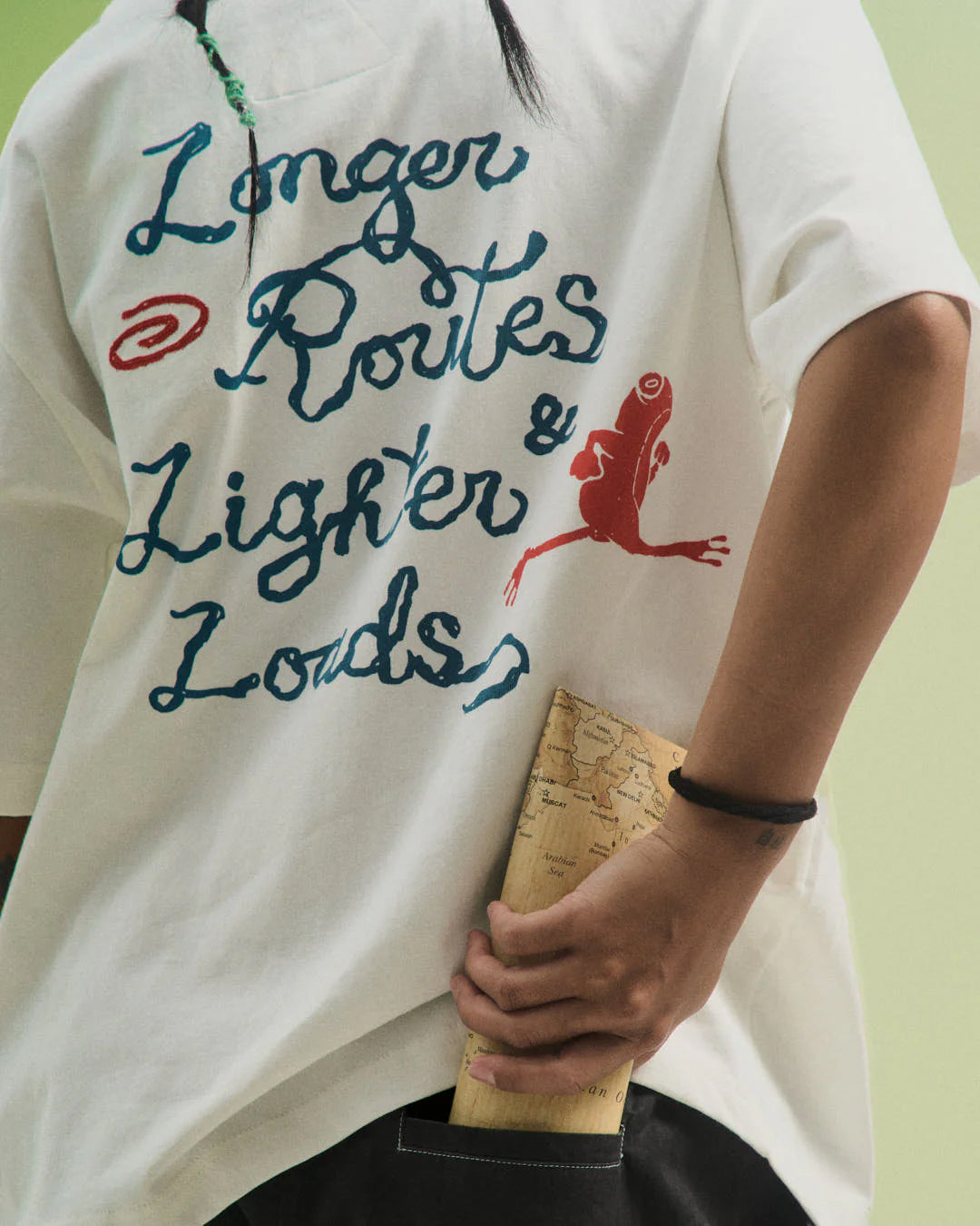 A Eckhaus Latta Shirt pictured on a model in front of a white background. The title of the product is Eckhaus Latta Eclipse Turtleneck - Stone and the image was taken by 199A®.