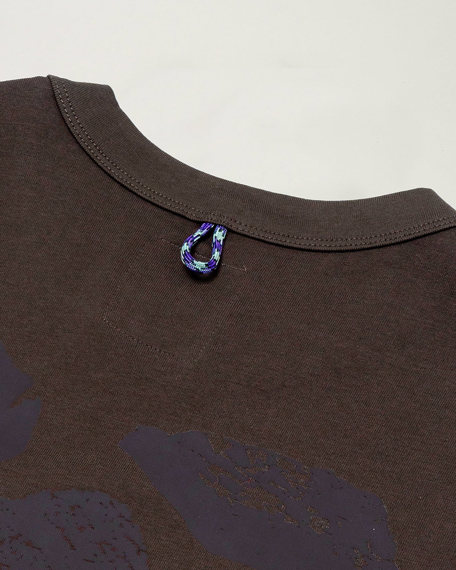 A Eckhaus Latta Shirt pictured on a model in front of a white background. The title of the product is Eckhaus Latta Eclipse Turtleneck - Stone and the image was taken by 199A®.