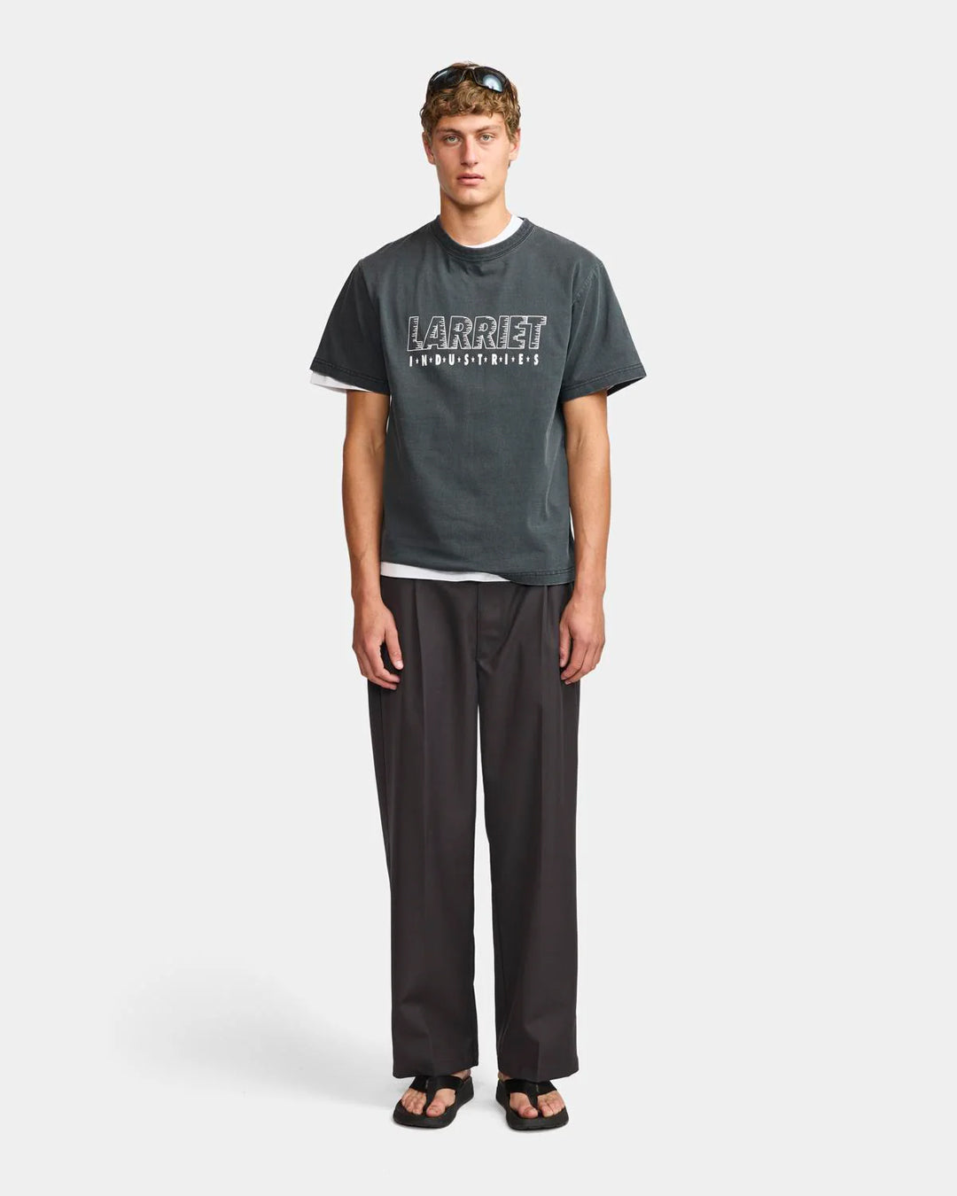 A Eckhaus Latta Shirt pictured on a model in front of a white background. The title of the product is Eckhaus Latta Eclipse Turtleneck - Stone and the image was taken by 199A®.
