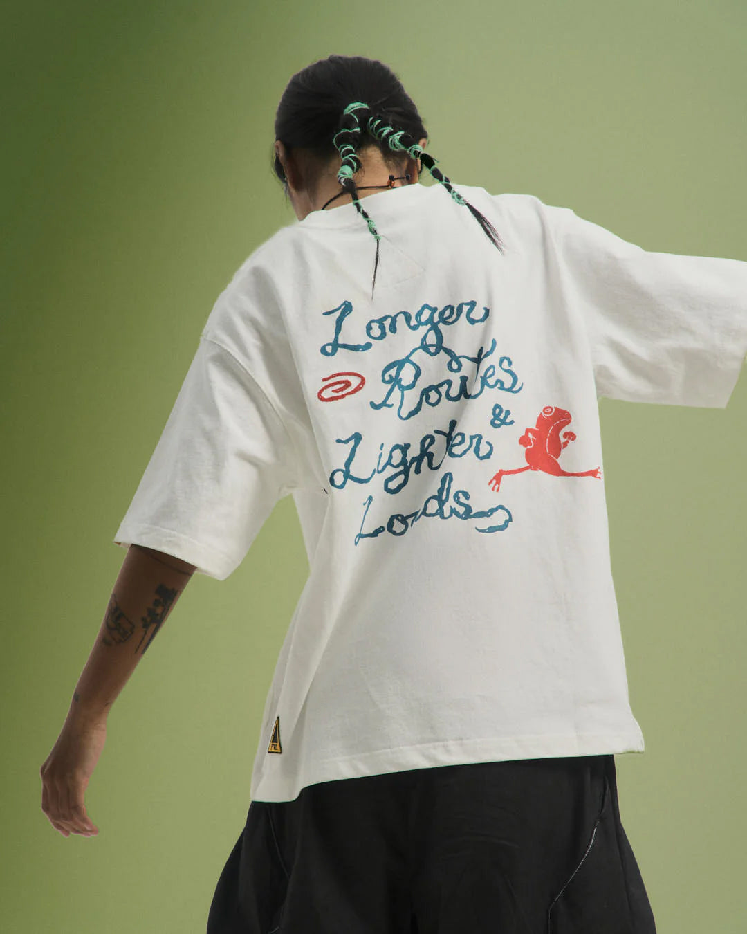 A Eckhaus Latta Shirt pictured on a model in front of a white background. The title of the product is Eckhaus Latta Eclipse Turtleneck - Stone and the image was taken by 199A®.