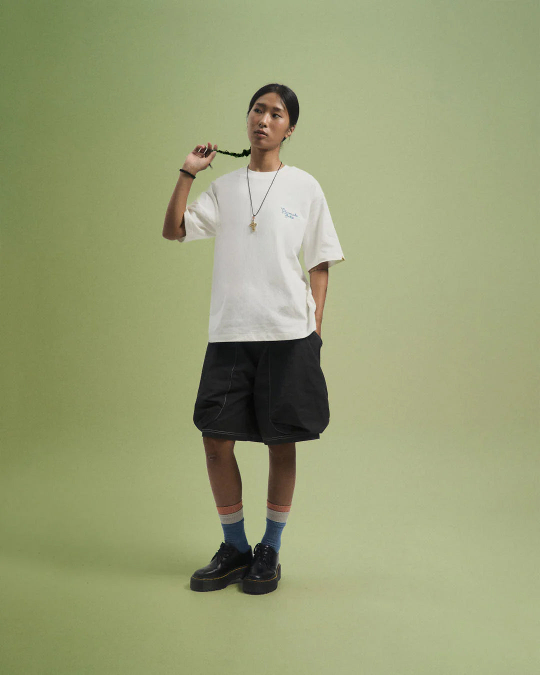 A Eckhaus Latta Shirt pictured on a model in front of a white background. The title of the product is Eckhaus Latta Eclipse Turtleneck - Stone and the image was taken by 199A®.