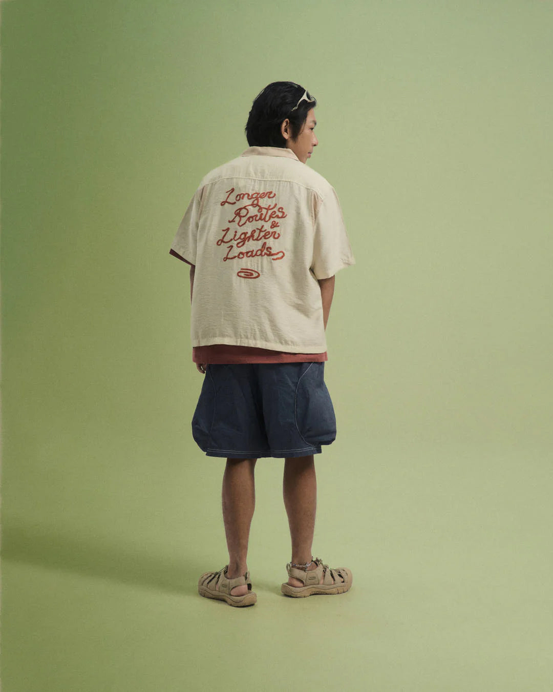 A Eckhaus Latta Shirt pictured on a model in front of a white background. The title of the product is Eckhaus Latta Eclipse Turtleneck - Stone and the image was taken by 199A®.