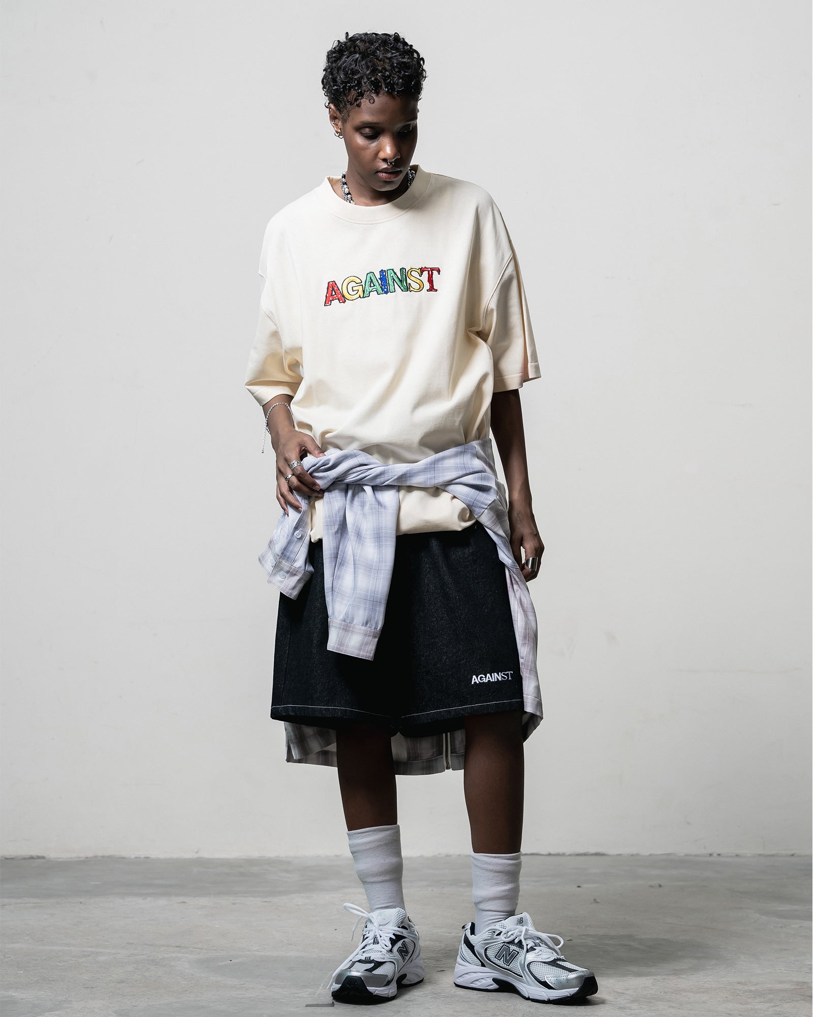 A Eckhaus Latta Shirt pictured on a model in front of a white background. The title of the product is Eckhaus Latta Eclipse Turtleneck - Stone and the image was taken by 199A®.