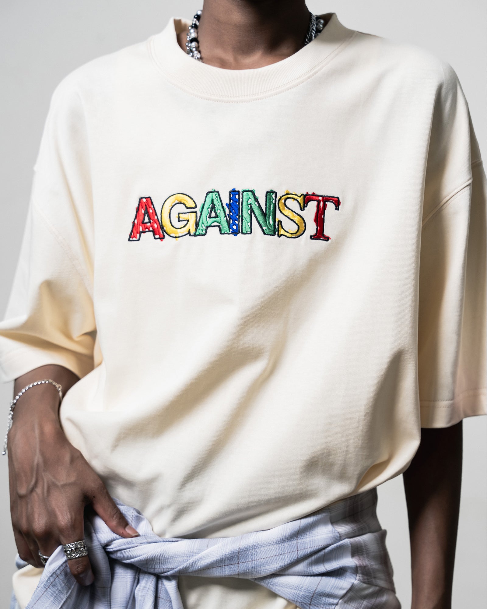 A Eckhaus Latta Shirt pictured on a model in front of a white background. The title of the product is Eckhaus Latta Eclipse Turtleneck - Stone and the image was taken by 199A®.