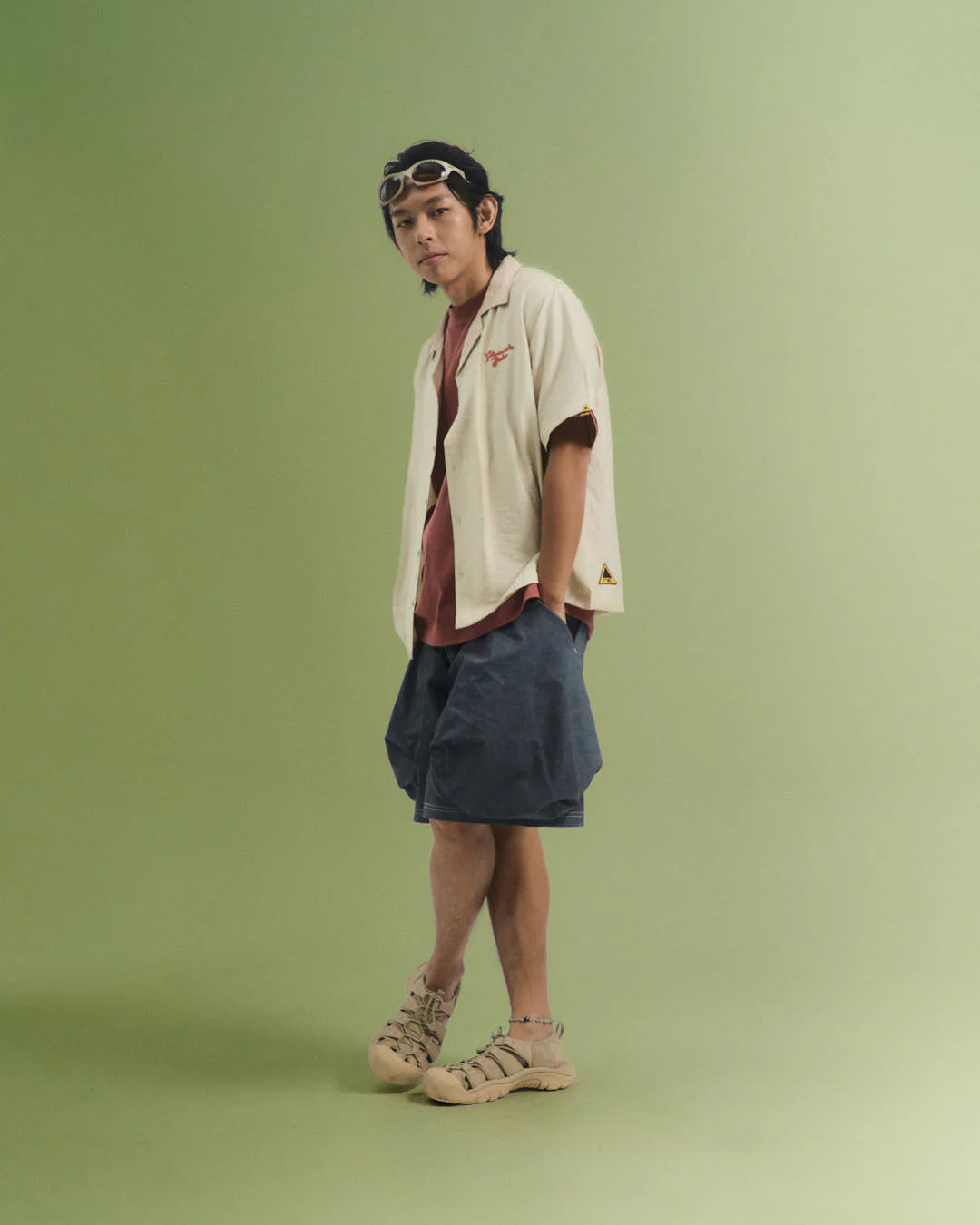 A Eckhaus Latta Shirt pictured on a model in front of a white background. The title of the product is Eckhaus Latta Eclipse Turtleneck - Stone and the image was taken by 199A®.