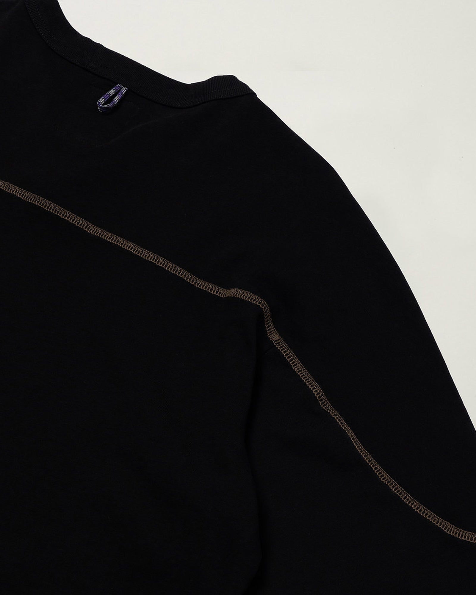 A Eckhaus Latta Shirt pictured on a model in front of a white background. The title of the product is Eckhaus Latta Eclipse Turtleneck - Stone and the image was taken by 199A®.