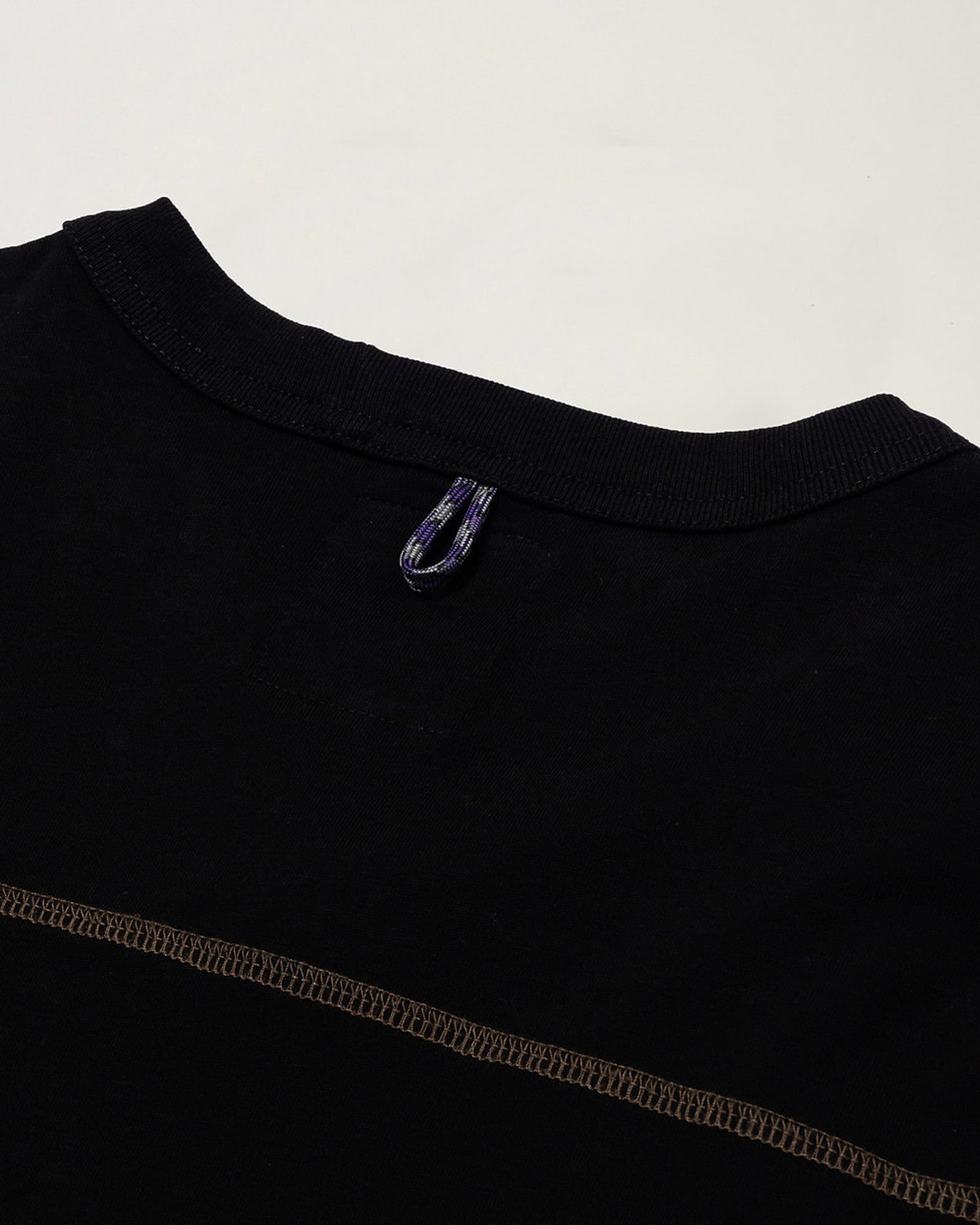 A Eckhaus Latta Shirt pictured on a model in front of a white background. The title of the product is Eckhaus Latta Eclipse Turtleneck - Stone and the image was taken by 199A®.