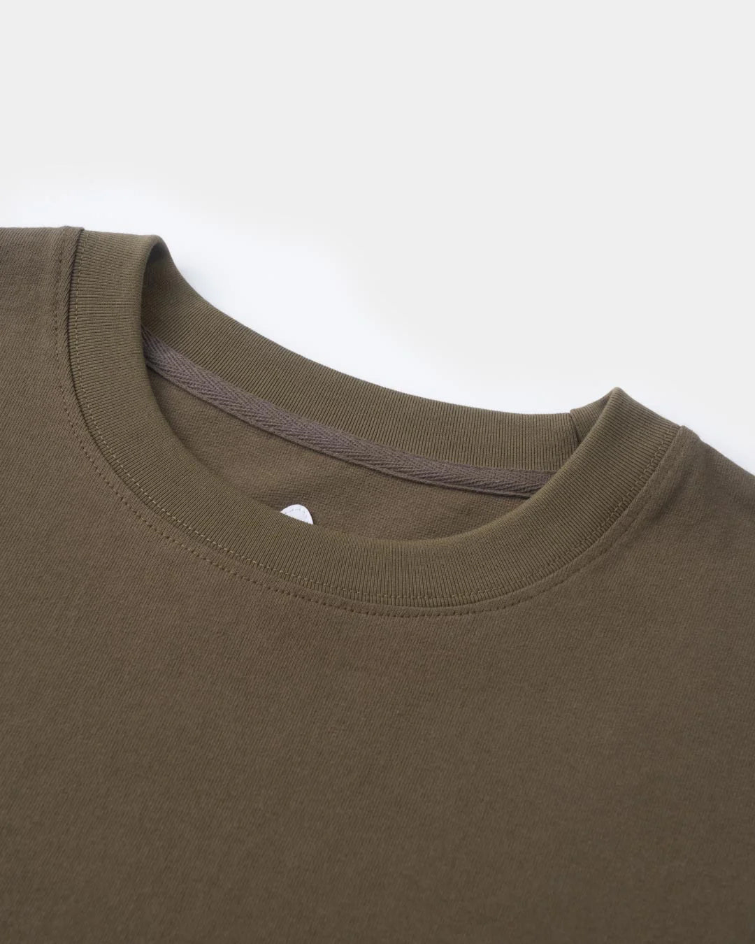 A Eckhaus Latta Shirt pictured on a model in front of a white background. The title of the product is Eckhaus Latta Eclipse Turtleneck - Stone and the image was taken by 199A®.