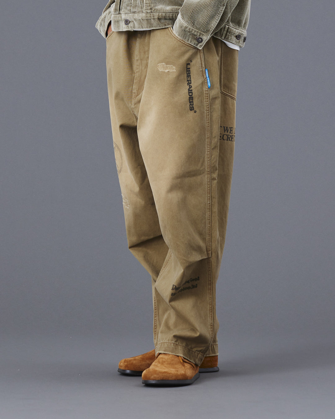 A Eckhaus Latta Shirt pictured on a model in front of a white background. The title of the product is Eckhaus Latta Eclipse Turtleneck - Stone and the image was taken by 199A®.