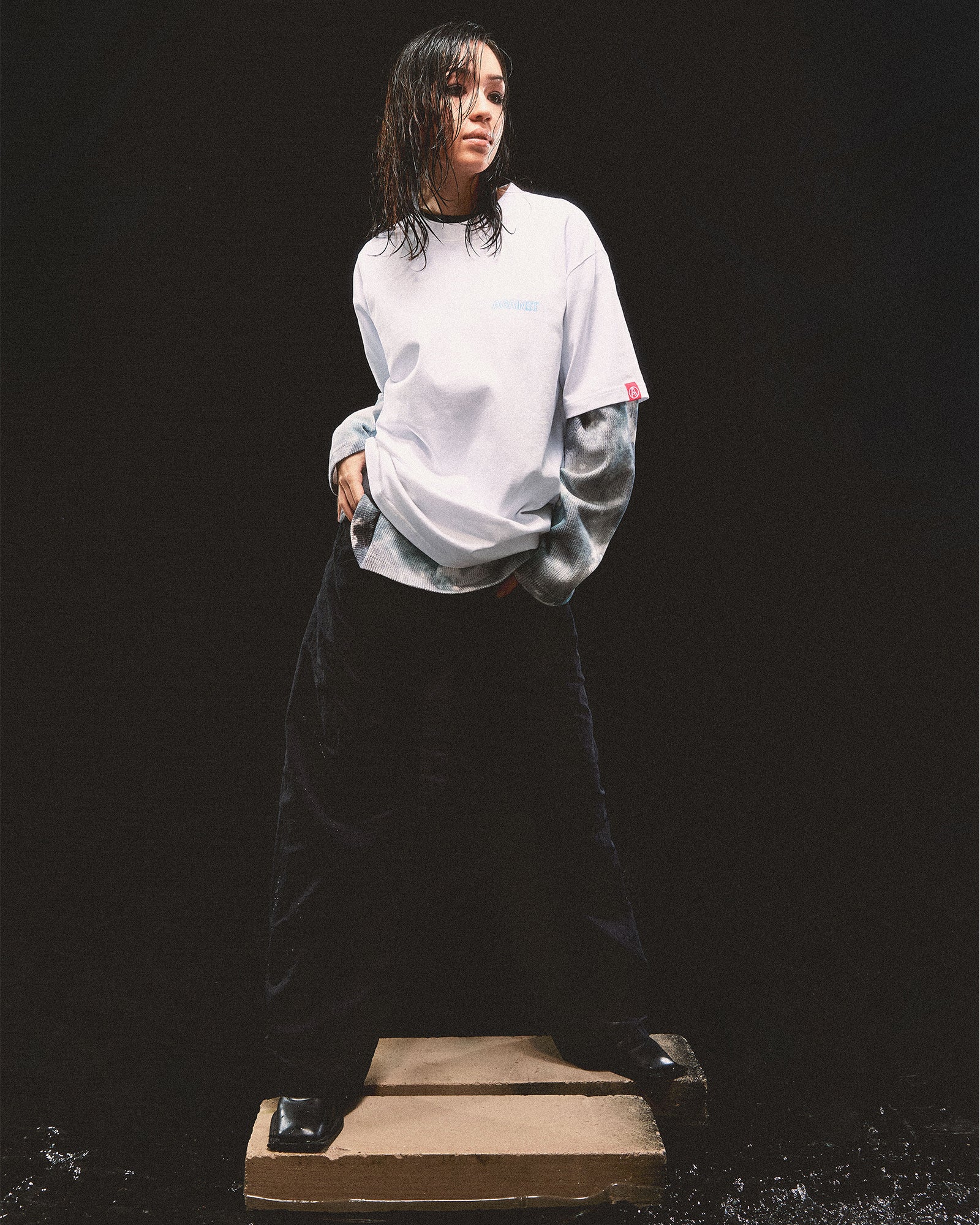 A Eckhaus Latta Shirt pictured on a model in front of a white background. The title of the product is Eckhaus Latta Eclipse Turtleneck - Stone and the image was taken by 199A®.