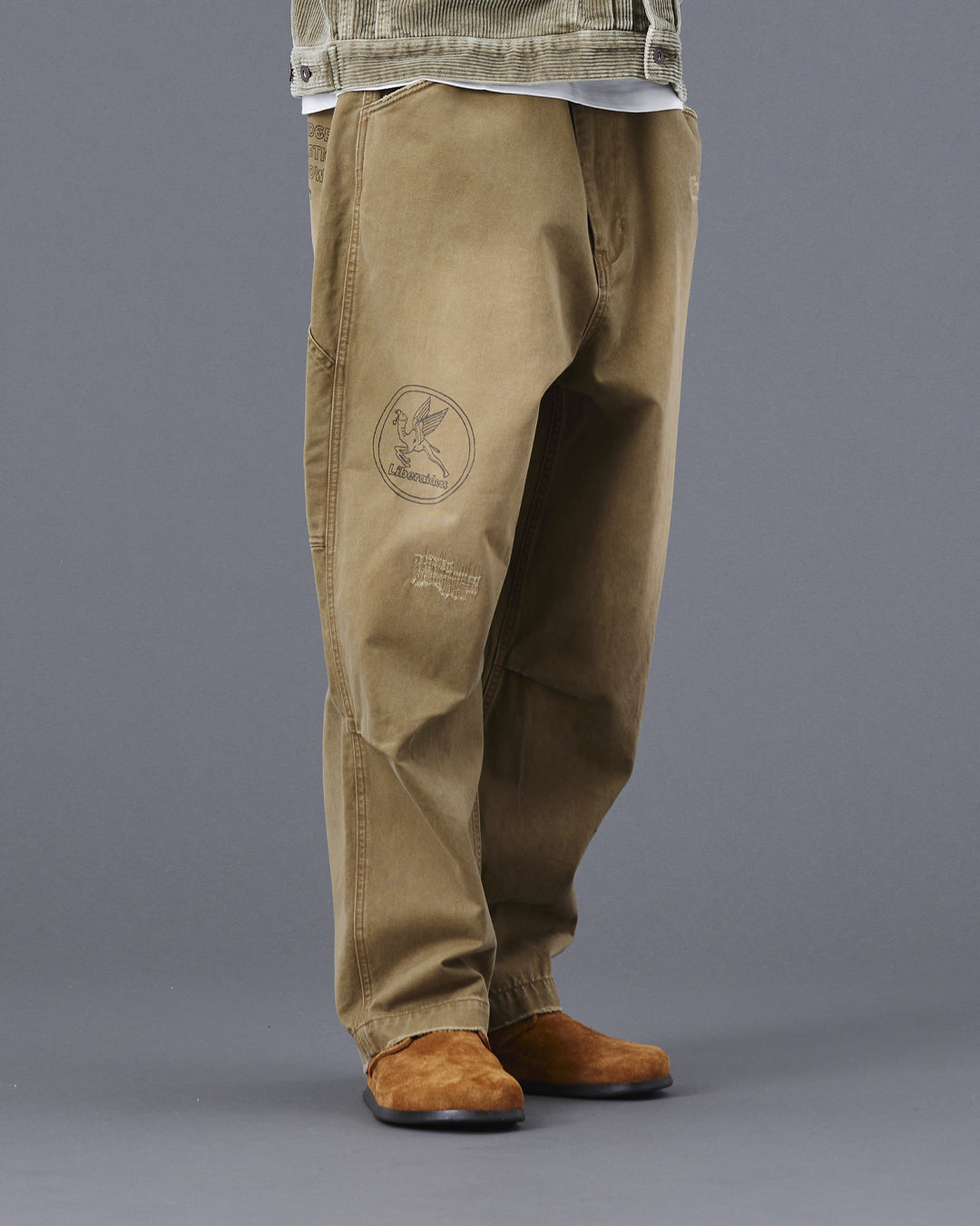 A Eckhaus Latta Shirt pictured on a model in front of a white background. The title of the product is Eckhaus Latta Eclipse Turtleneck - Stone and the image was taken by 199A®.