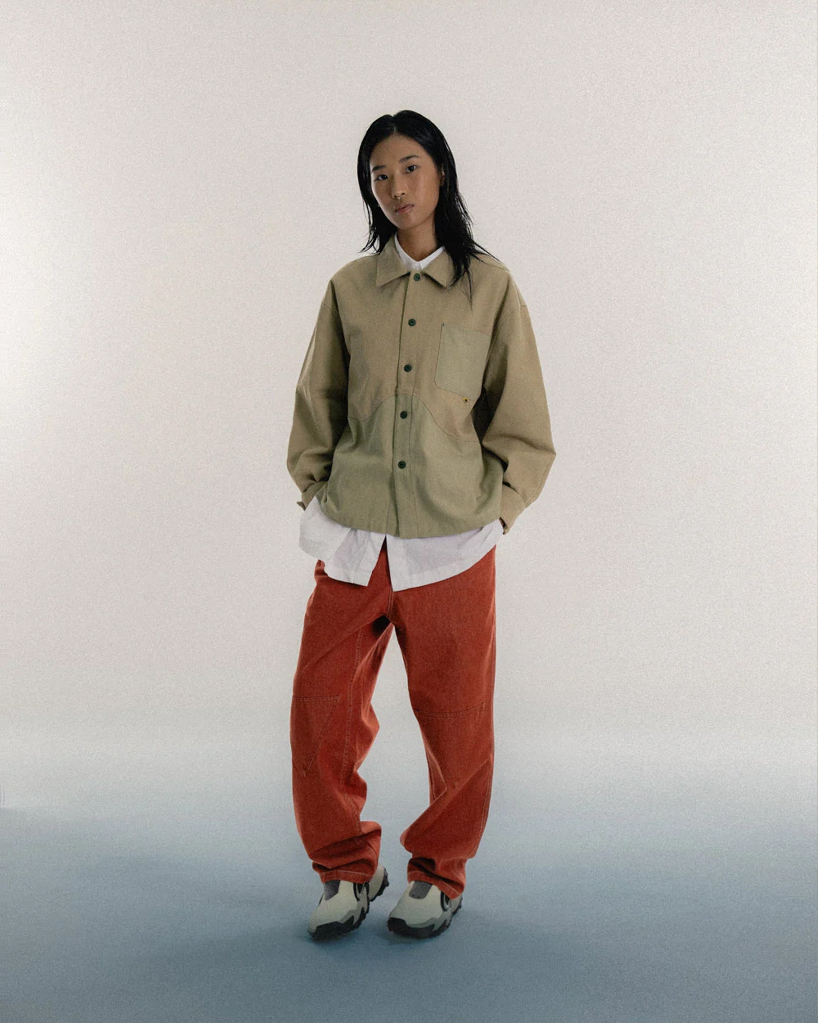 A Eckhaus Latta Shirt pictured on a model in front of a white background. The title of the product is Eckhaus Latta Eclipse Turtleneck - Stone and the image was taken by 199A®.