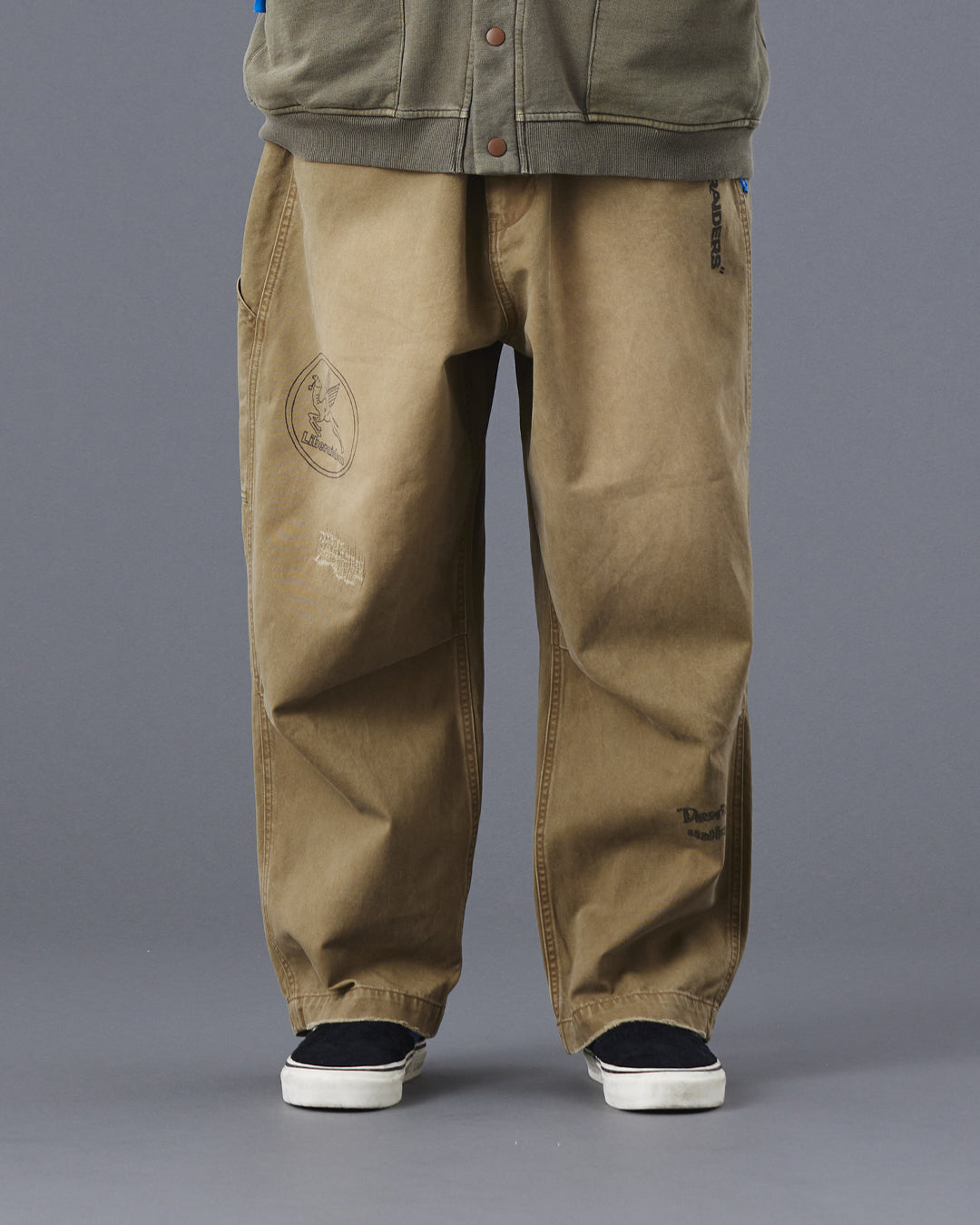 A Eckhaus Latta Shirt pictured on a model in front of a white background. The title of the product is Eckhaus Latta Eclipse Turtleneck - Stone and the image was taken by 199A®.