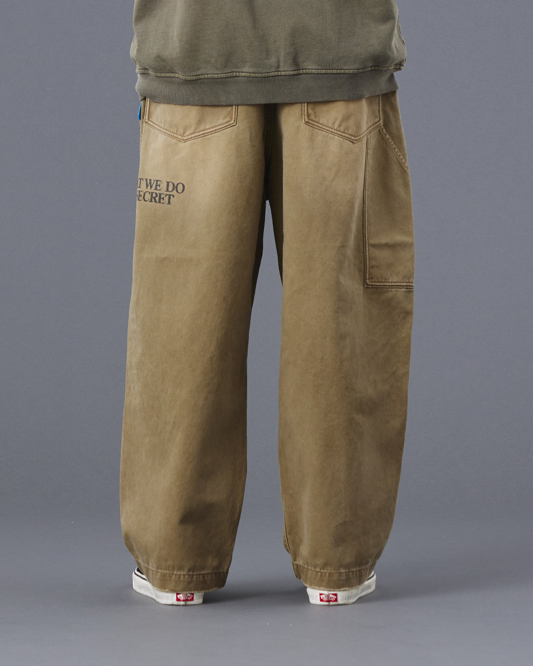 A Eckhaus Latta Shirt pictured on a model in front of a white background. The title of the product is Eckhaus Latta Eclipse Turtleneck - Stone and the image was taken by 199A®.