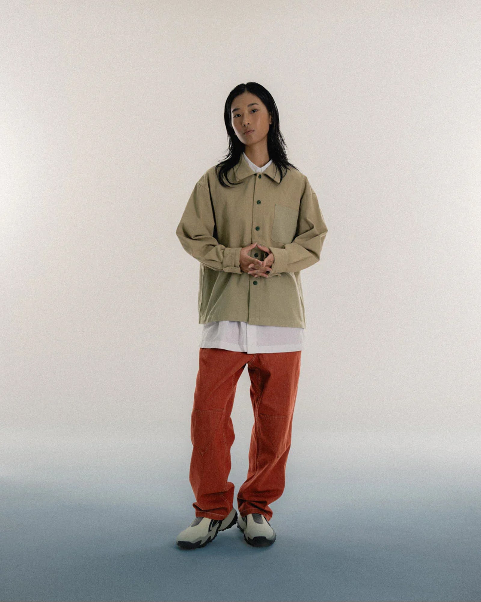 A Eckhaus Latta Shirt pictured on a model in front of a white background. The title of the product is Eckhaus Latta Eclipse Turtleneck - Stone and the image was taken by 199A®.