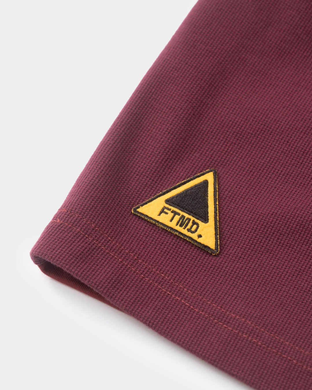 A Eckhaus Latta Shirt pictured on a model in front of a white background. The title of the product is Eckhaus Latta Eclipse Turtleneck - Stone and the image was taken by 199A®.