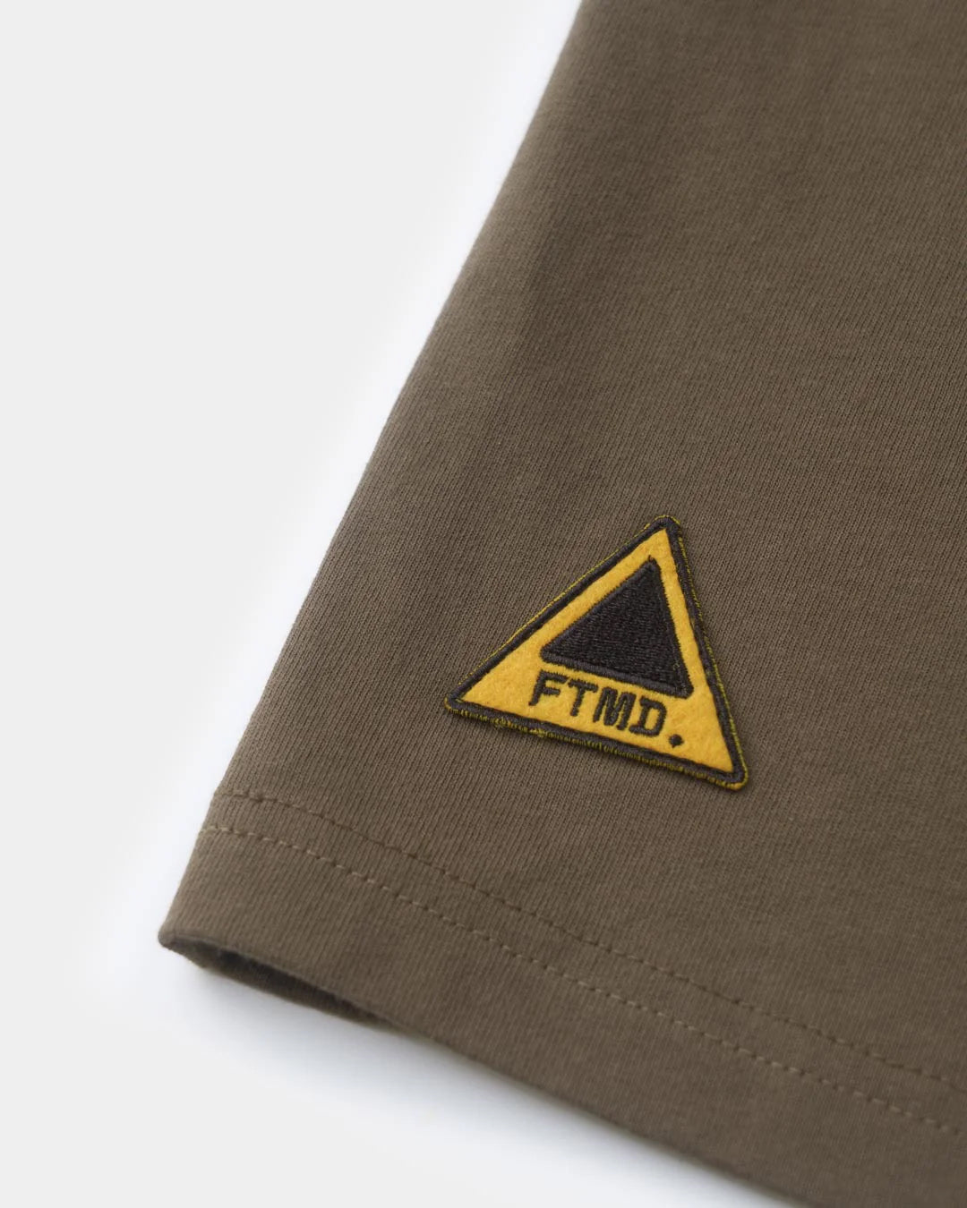 A Eckhaus Latta Shirt pictured on a model in front of a white background. The title of the product is Eckhaus Latta Eclipse Turtleneck - Stone and the image was taken by 199A®.